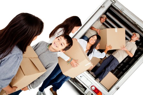 Removal team planning a move in a Chelsea residential street