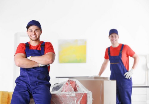 Removal van and moving team preparing for a Chelsea home move
