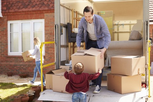 Professional movers handling fragile items during a Chelsea move