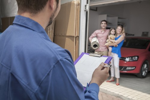 Professional movers handling furniture in a Chelsea apartment