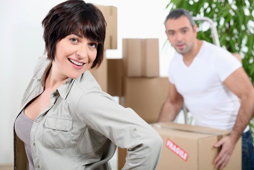 Packed moving boxes and furniture prepared for a Chelsea home move