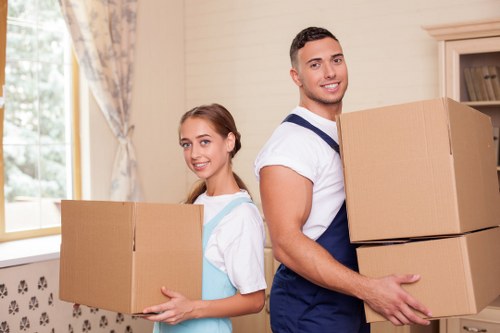 Professional movers handling furniture carefully in Chelsea