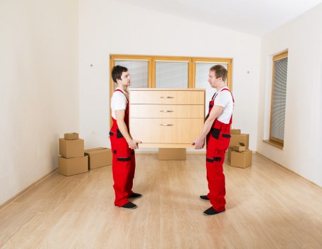 Packing and loading items into a removal truck in Chelsea
